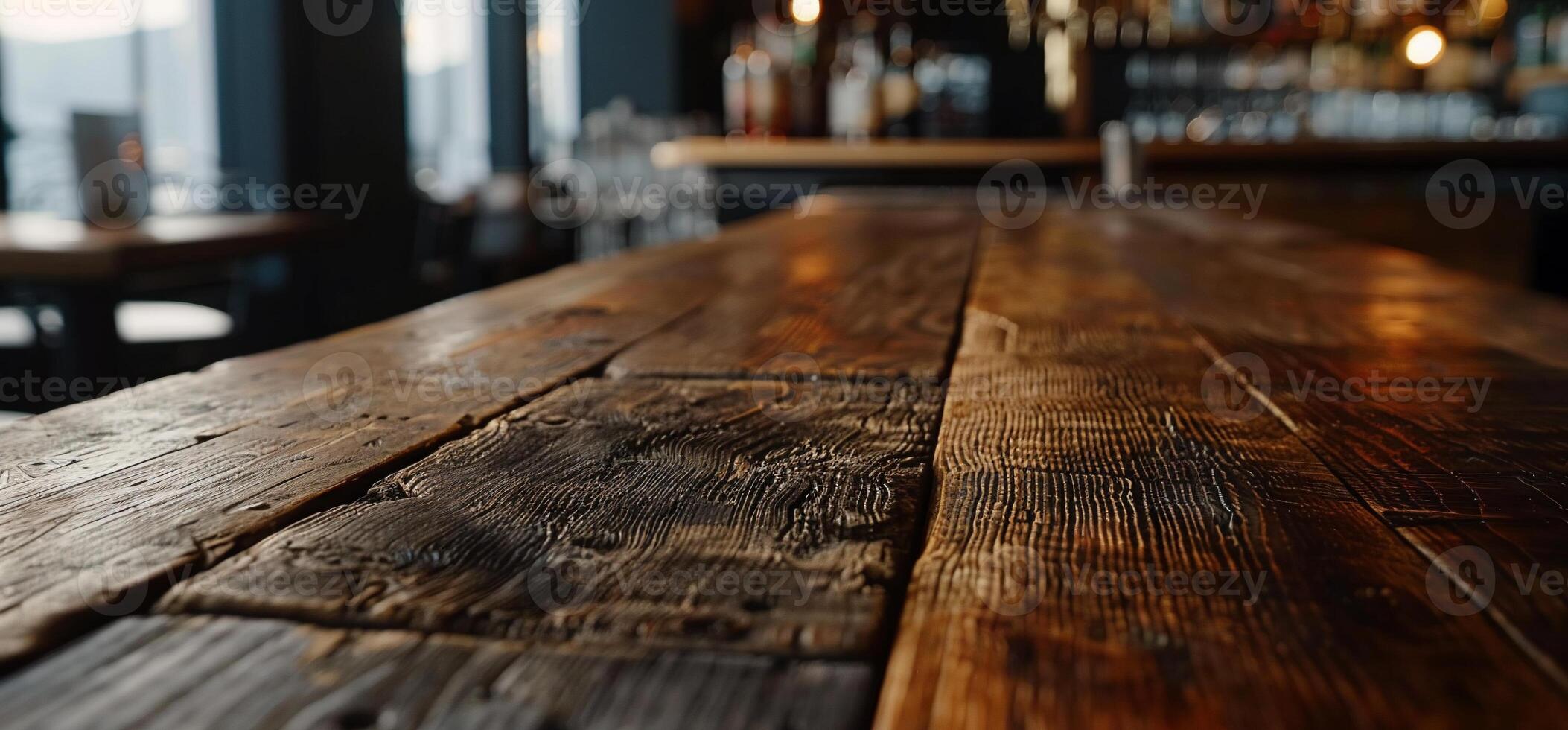 A close up of a bar table with a wooden top photo