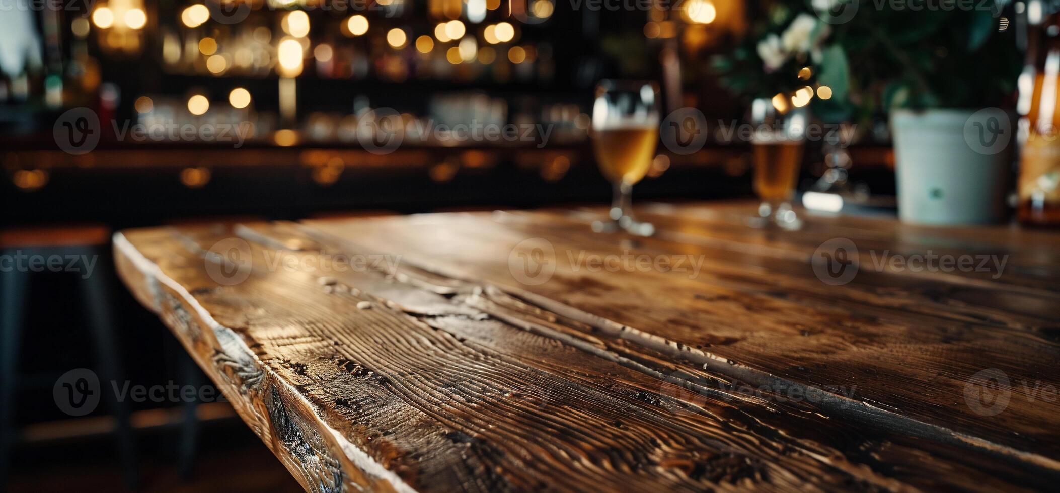 A wooden table with two glasses on it photo