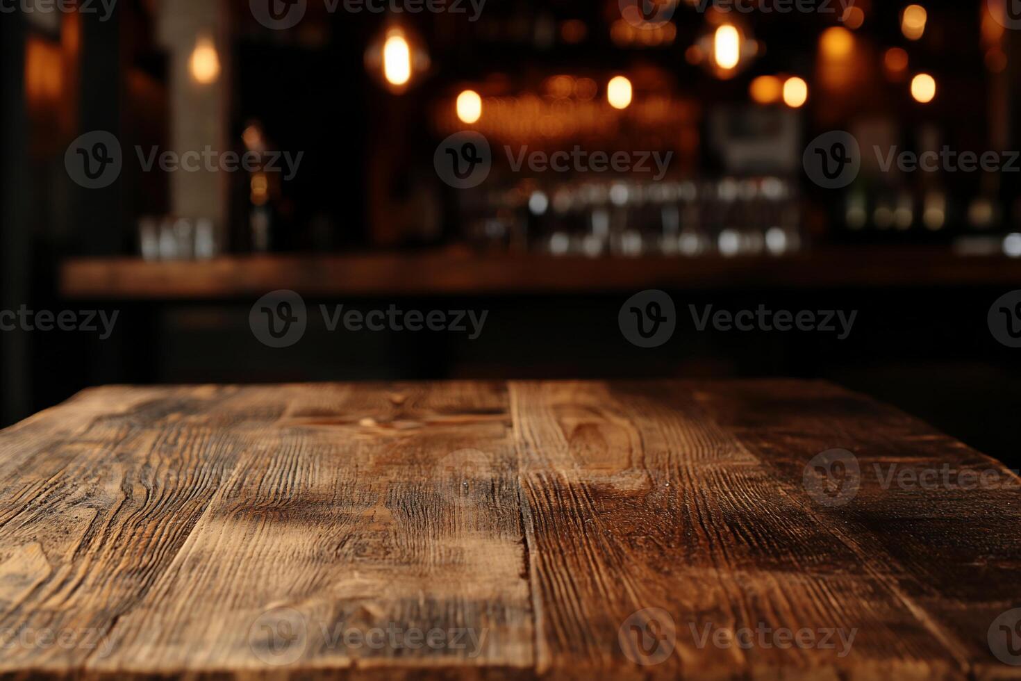 A wooden table in a bar with dim lights photo