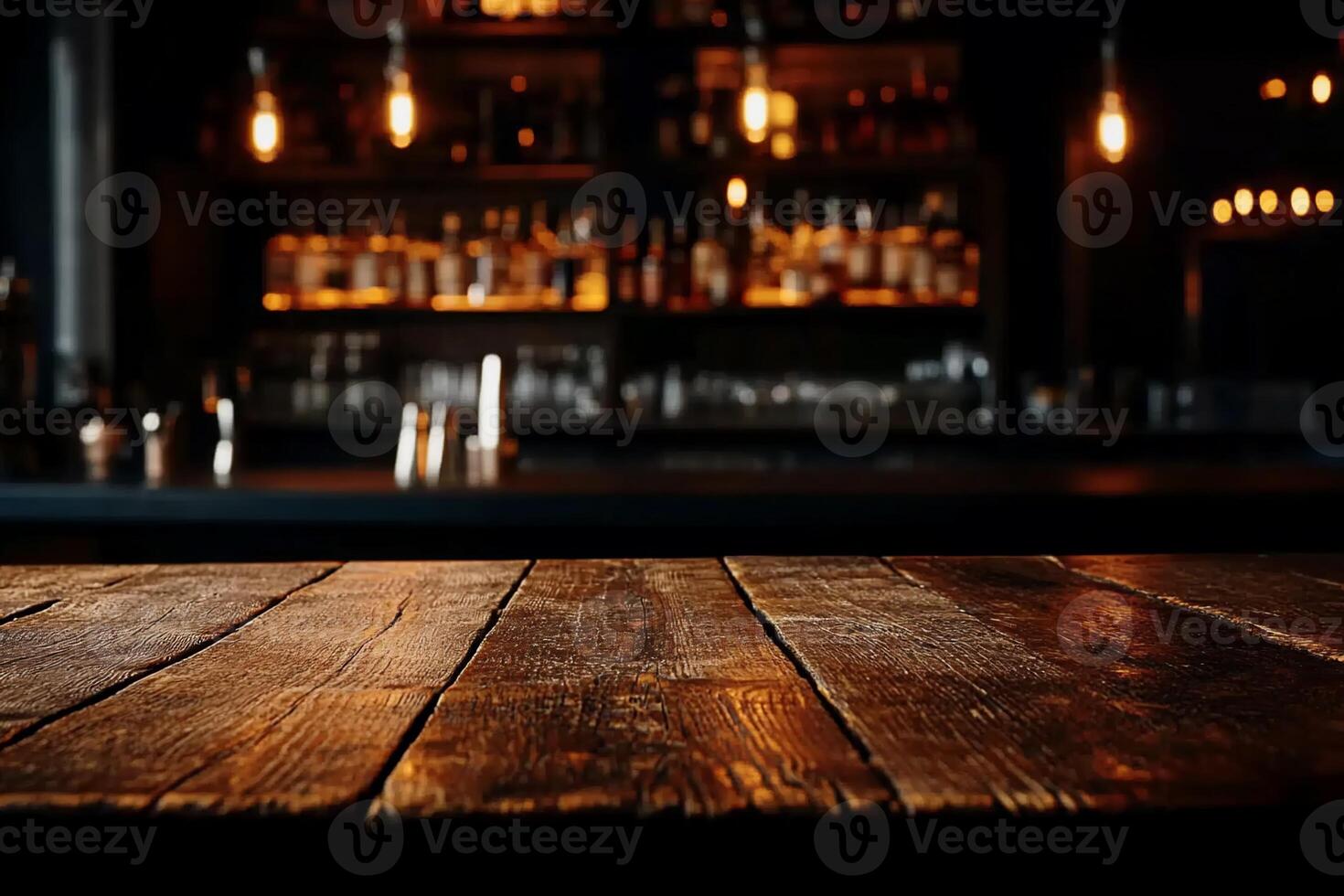 Rustic wooden bar table top, blurred background of a dark, dimly lit bar with bottles and lights photo