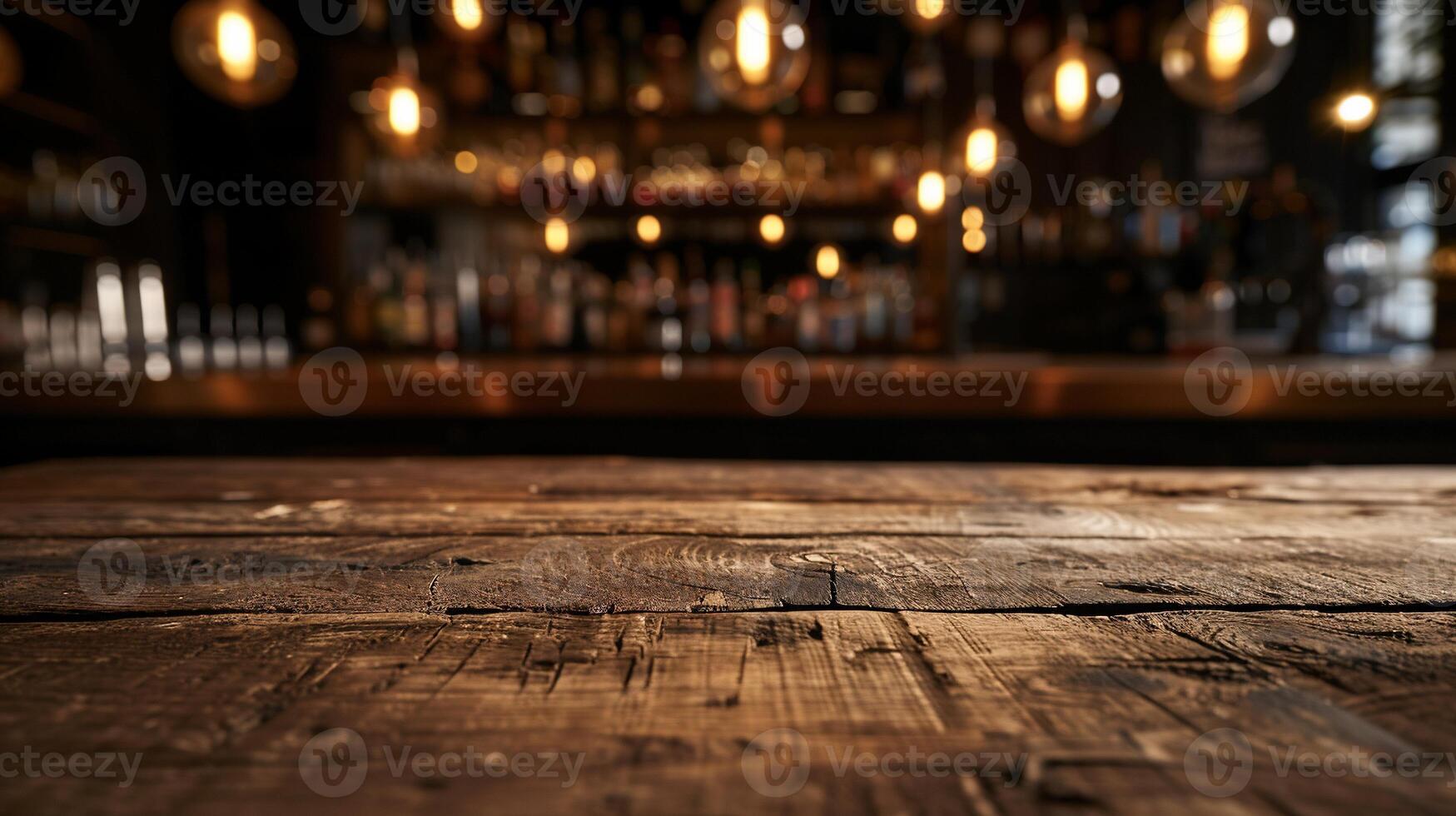 Rustic wooden bar top, blurred background of dimly lit bar area with hanging lights photo