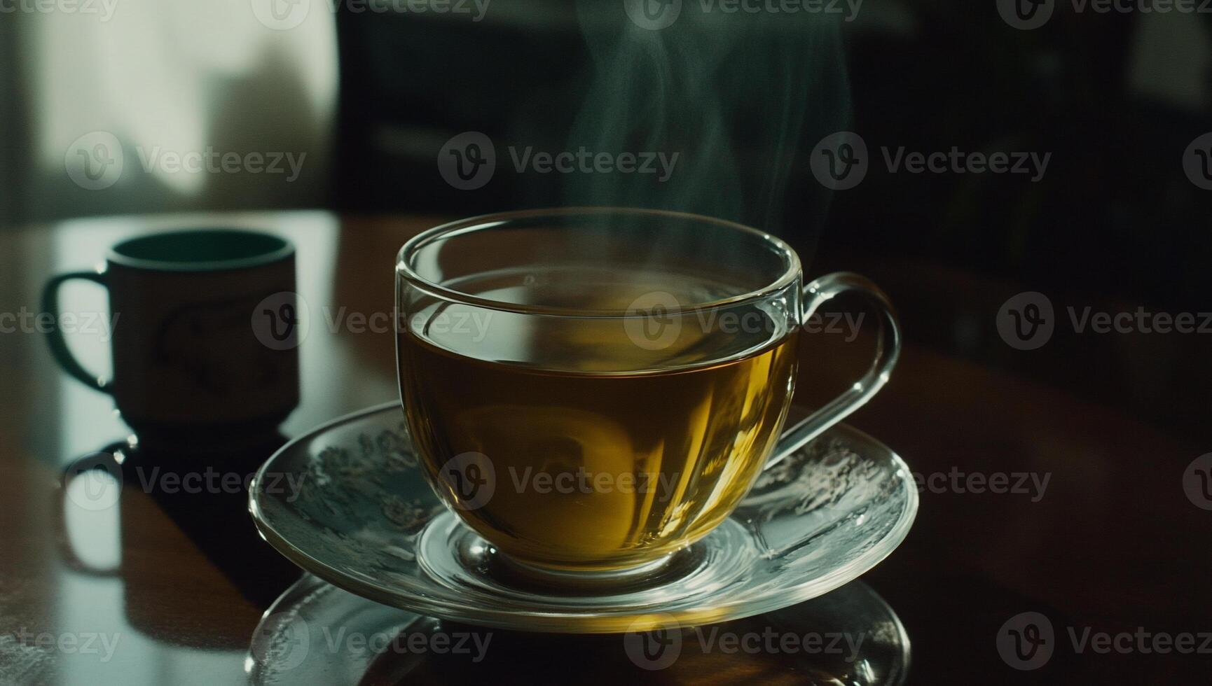 Steaming hot cup of tea on a table photo