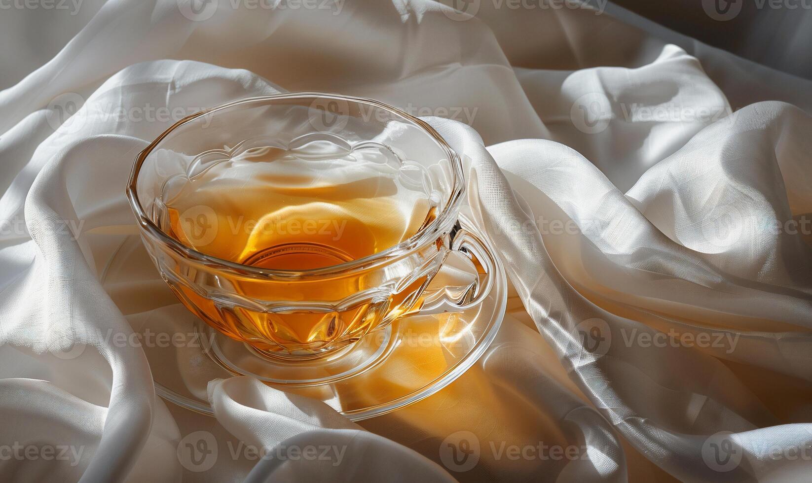 A warm cup of tea on a silky surface photo