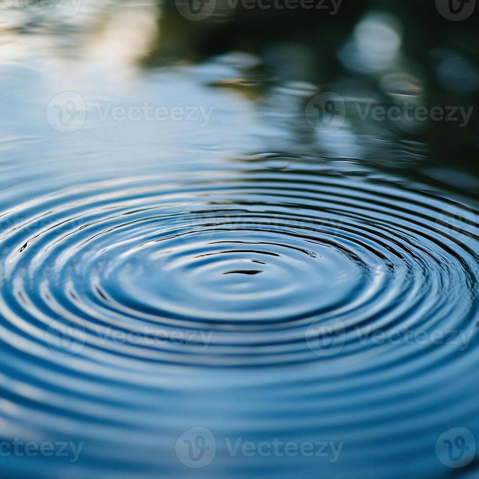 A circular ripple in the water is shown photo
