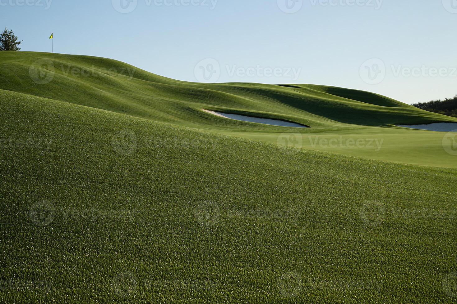 Lush golf course greens, gentle undulations, and a flag photo