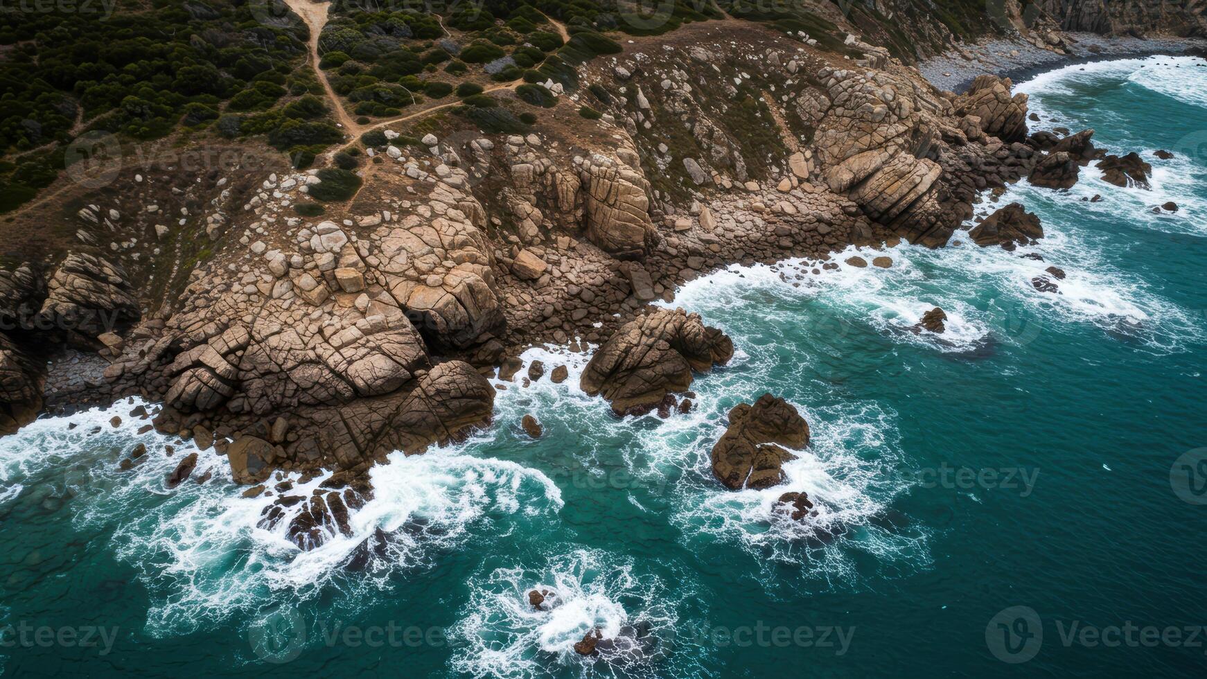 A beautiful coastal scene with crashing waves against rocky cliffs photo