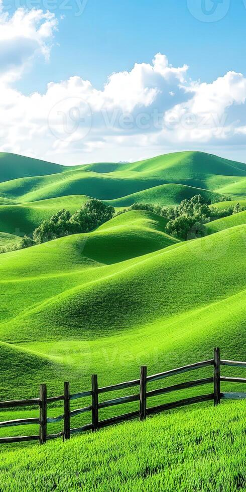 Green hills under blue sky photo