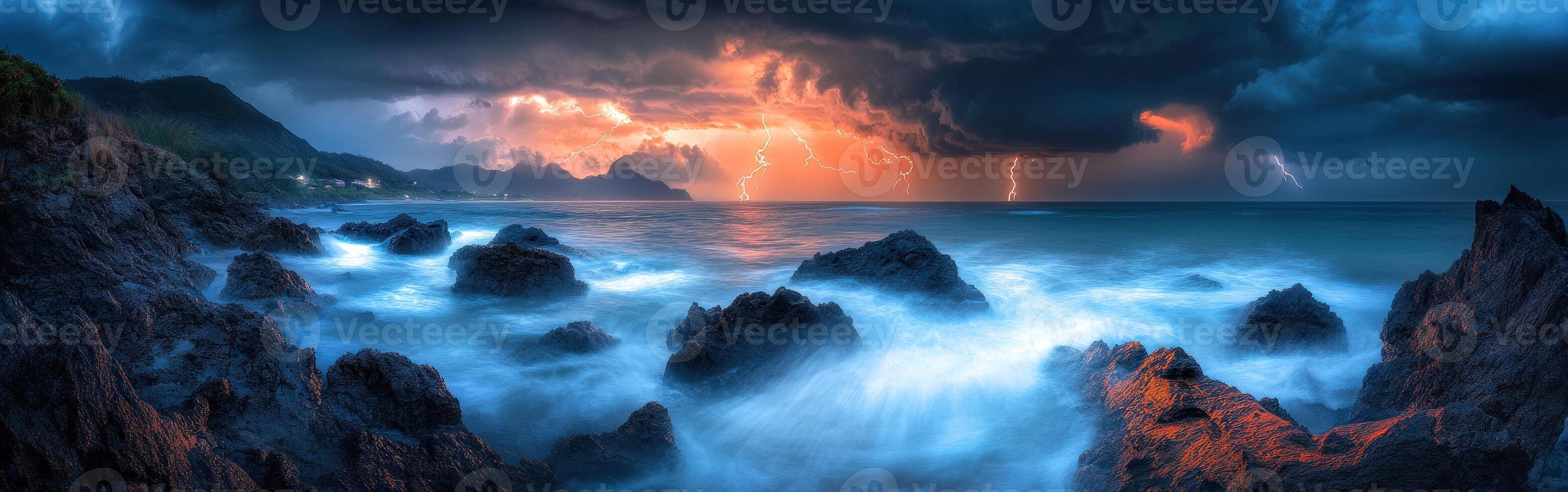 A stormy sky over the ocean with lightning and rocks photo