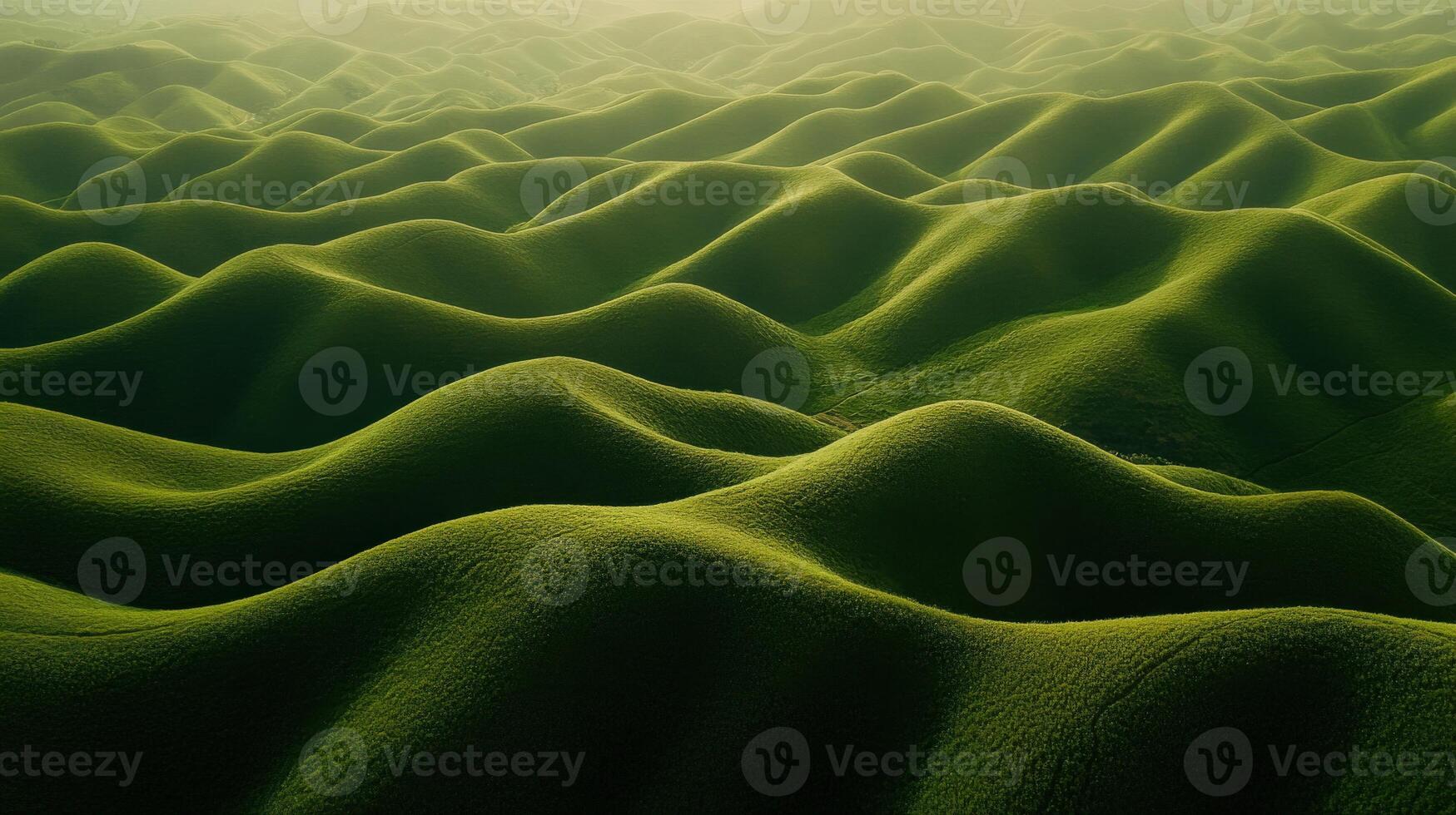 A green field with many hills and mountains photo