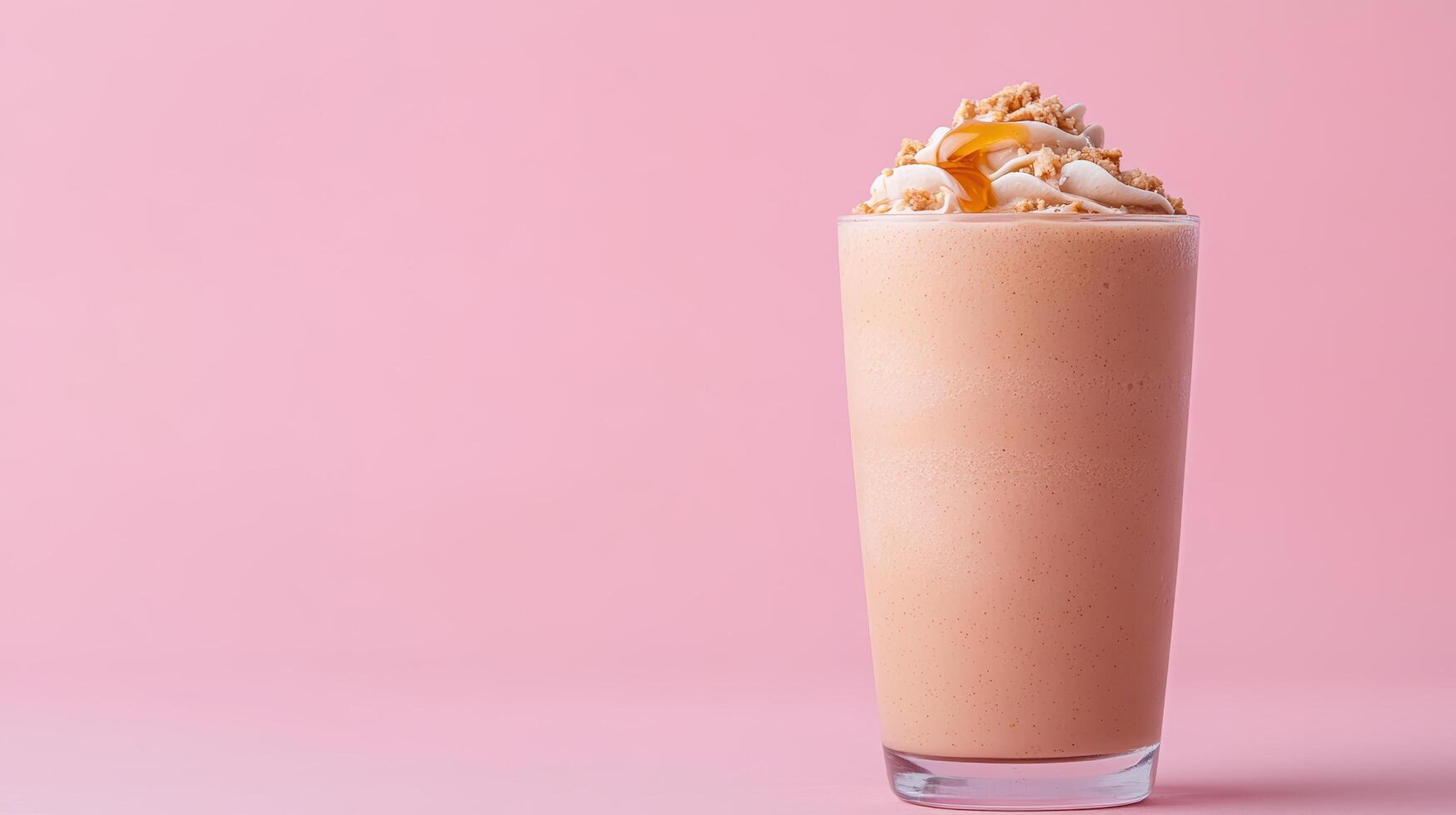 Creamy peanut butter banana smoothie topped with crunchy nuts, perfect for refreshing treat photo