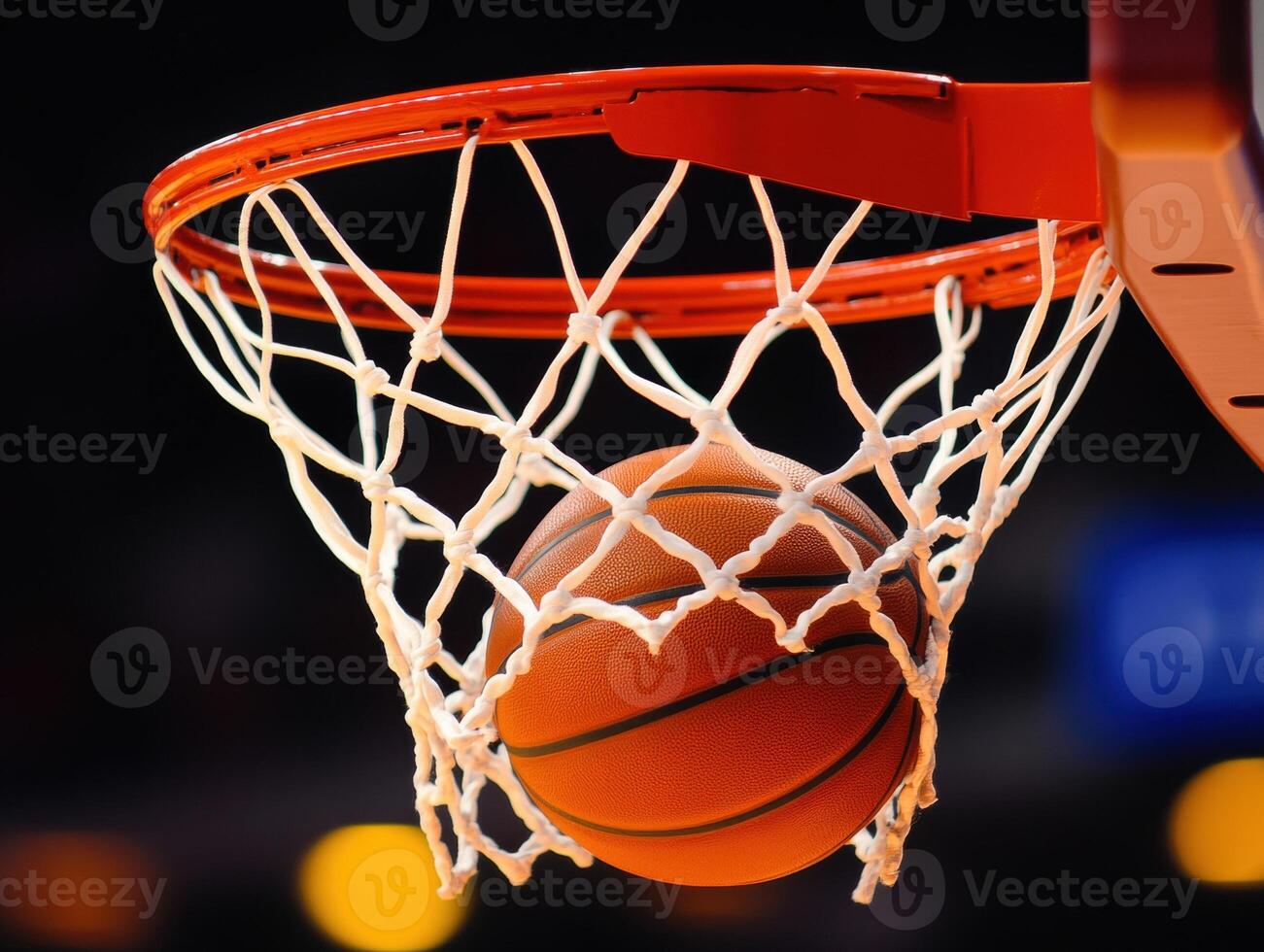 Basketball swishes through the net during an exciting game photo