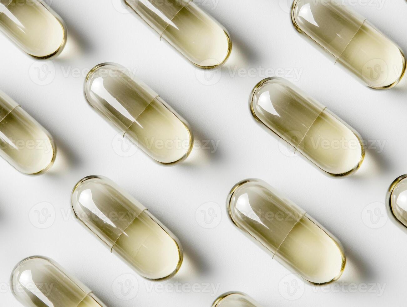 Capsules arranged in a pattern on a clean surface photo