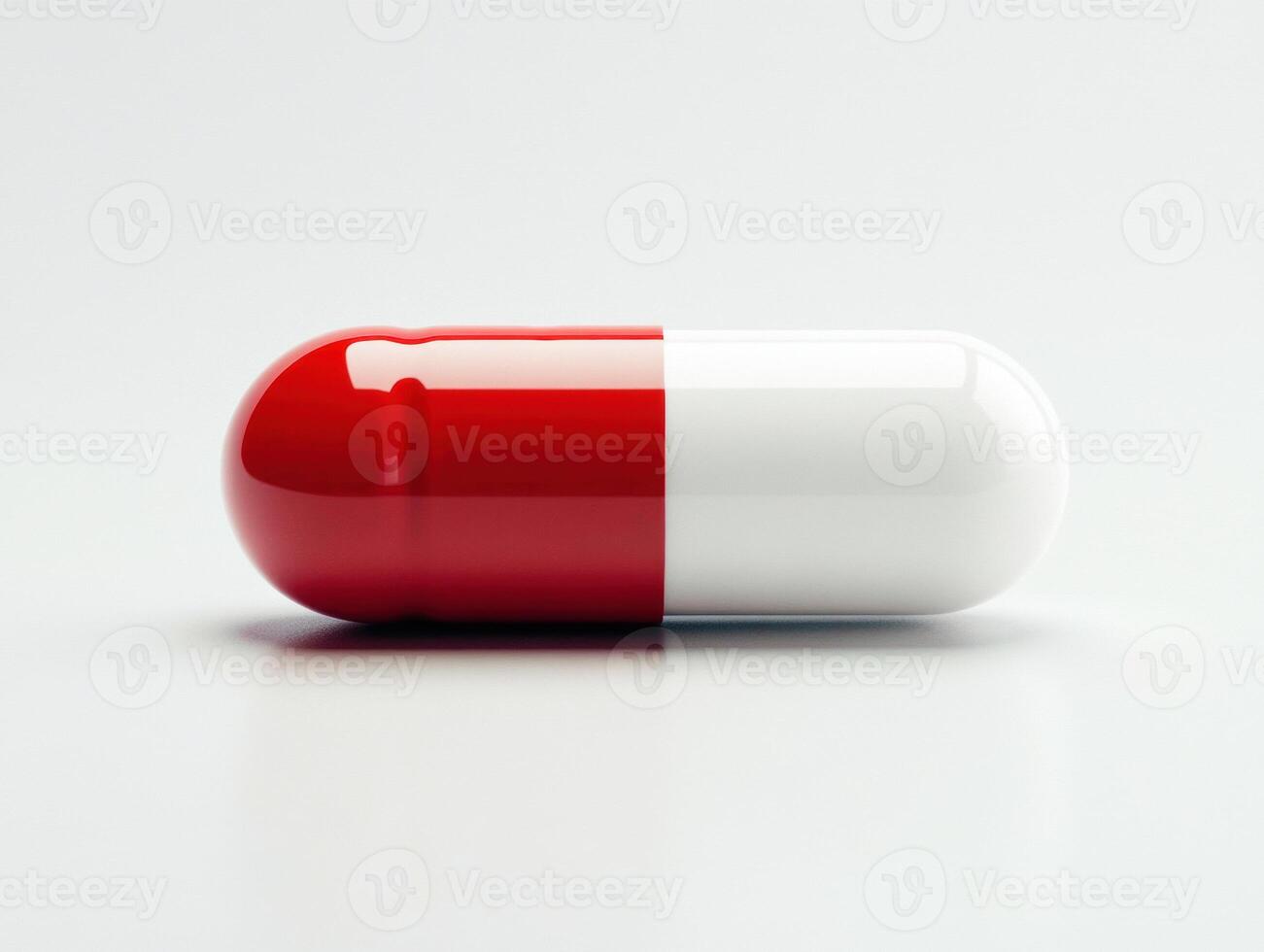 Red and white capsule on a clean surface ready for use photo