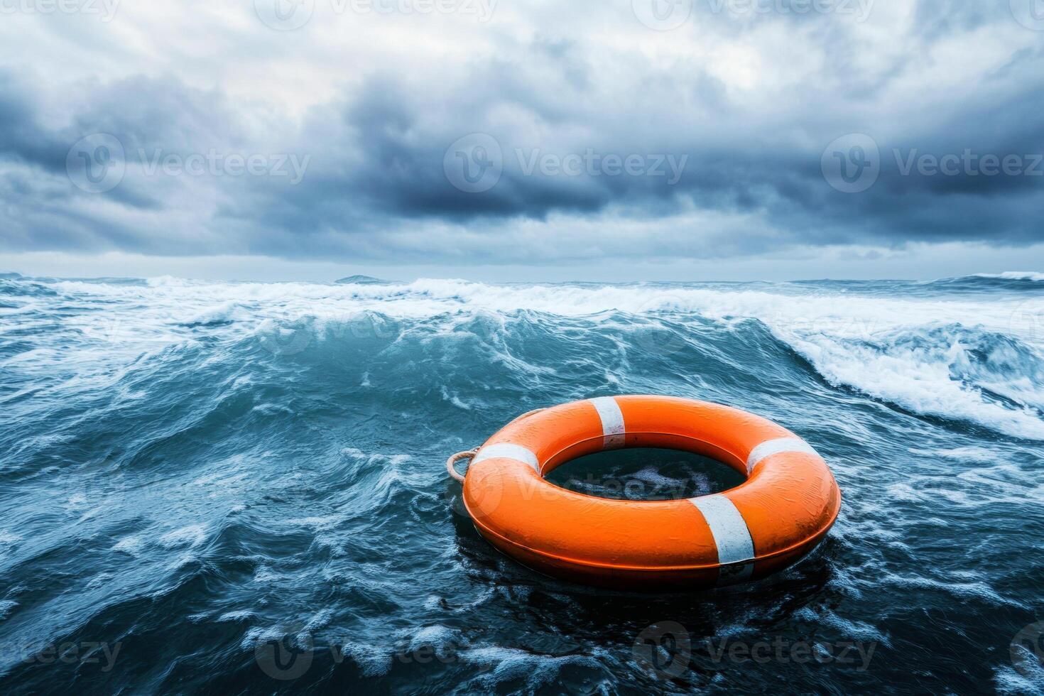 Lifebuoy floating in turbulent ocean waters under a cloudy sky photo