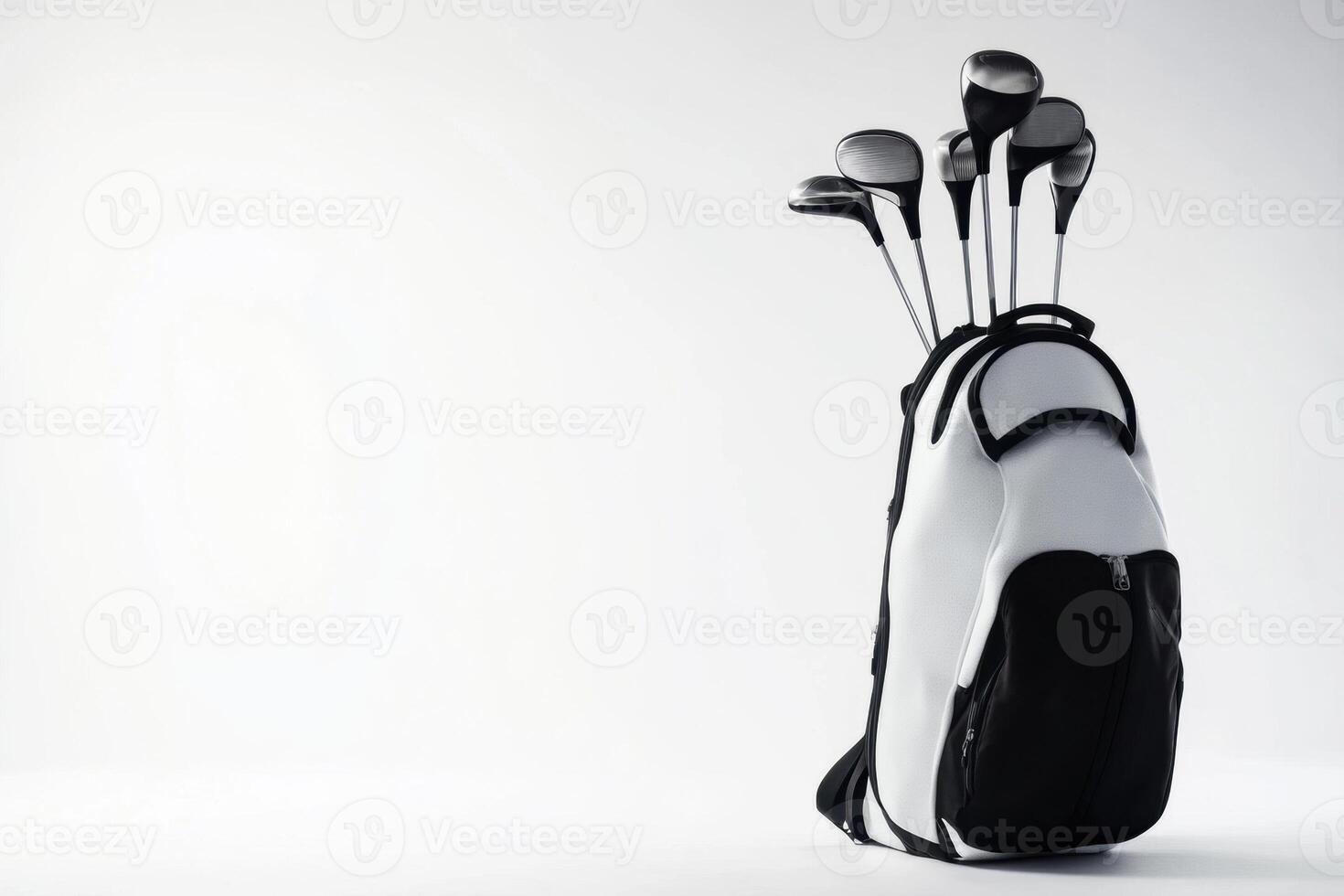 Golf clubs stored in a stylish black and white golf bag photo