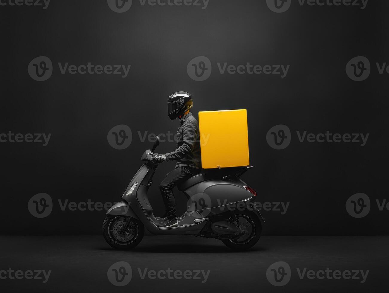 Delivery rider on scooter with yellow box in dark setting photo