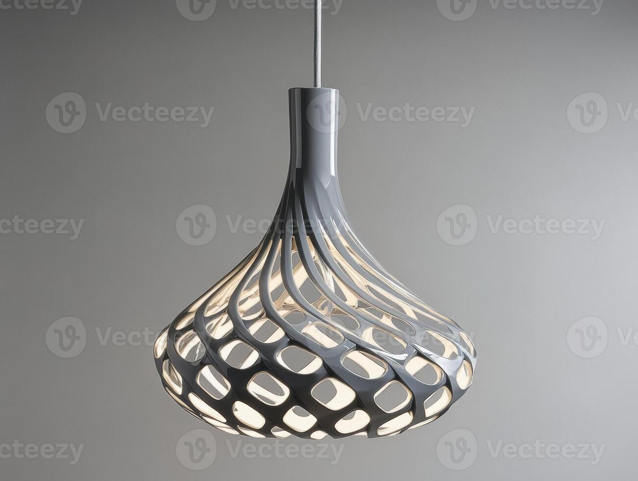 Modern pendant light with intricate design and warm glow photo