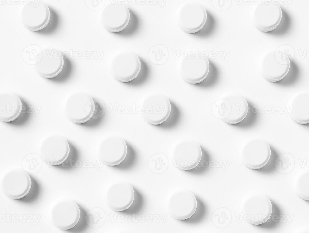 White circular tablets arranged in a neat pattern on a smooth surface photo