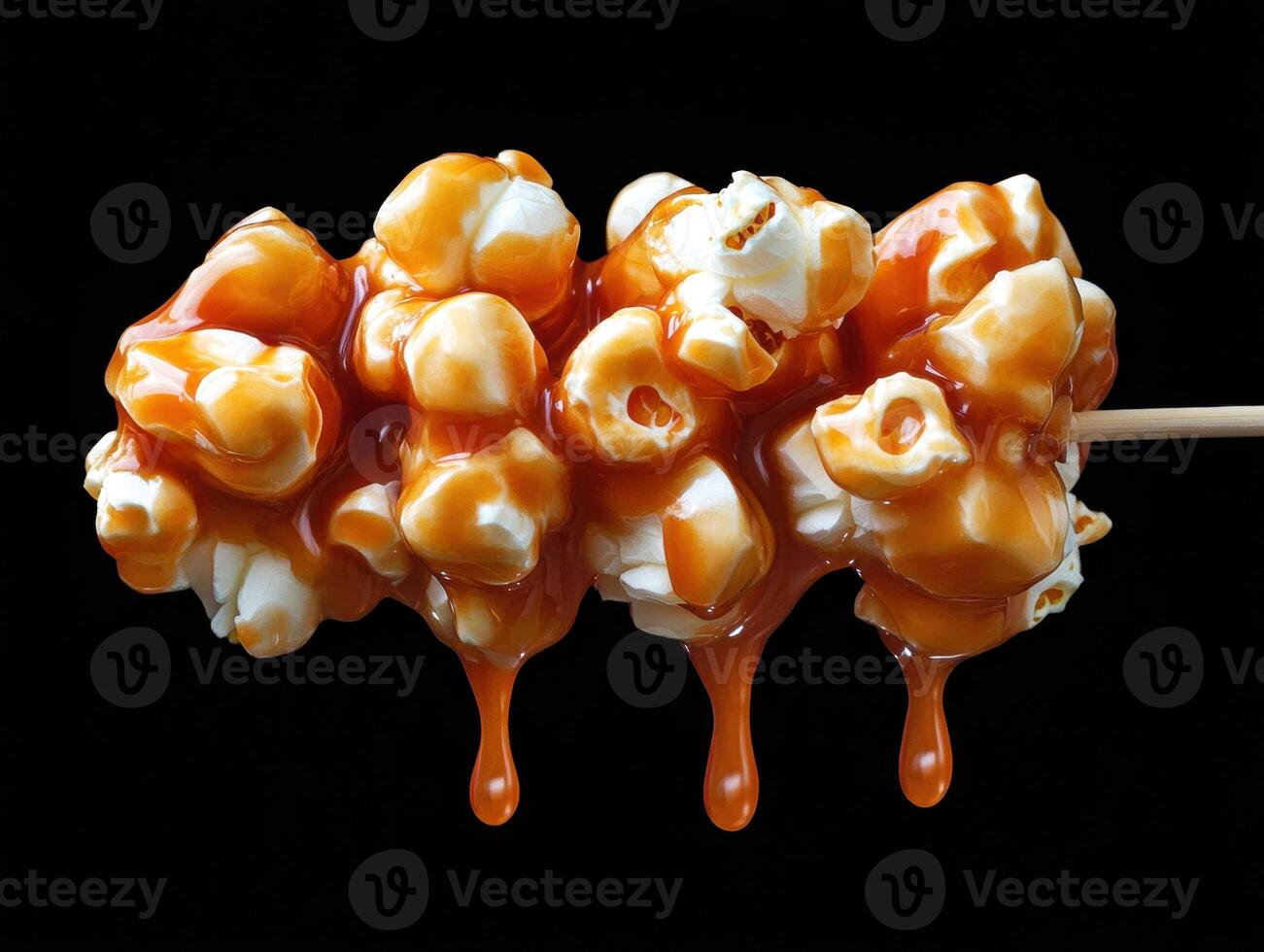 Sweet caramel popcorn on a stick ready for a tasty treat photo
