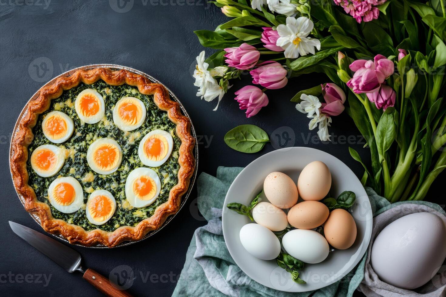 Spinach and egg quiche with spring flowers celebrating easter or mother's day photo