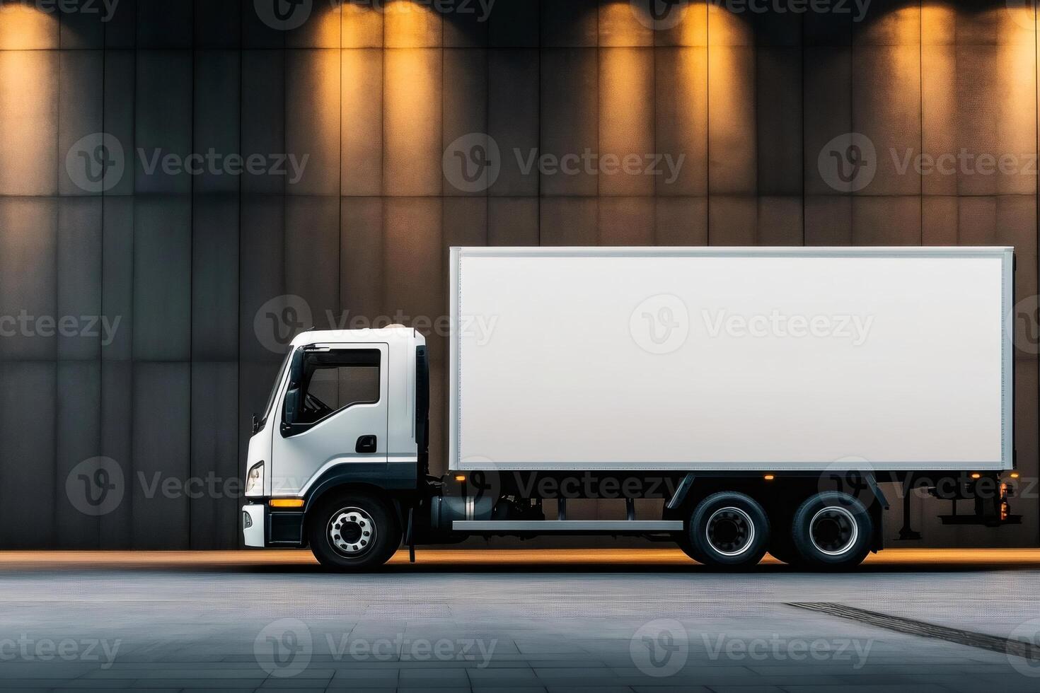 White delivery truck parked near modern building at night photo