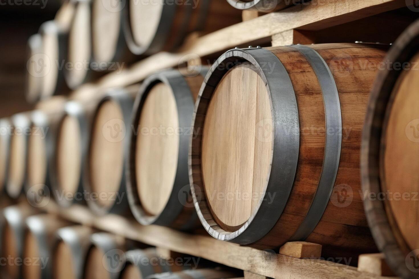 Wine barrels stacked in rows inside a winery cellar aging photo