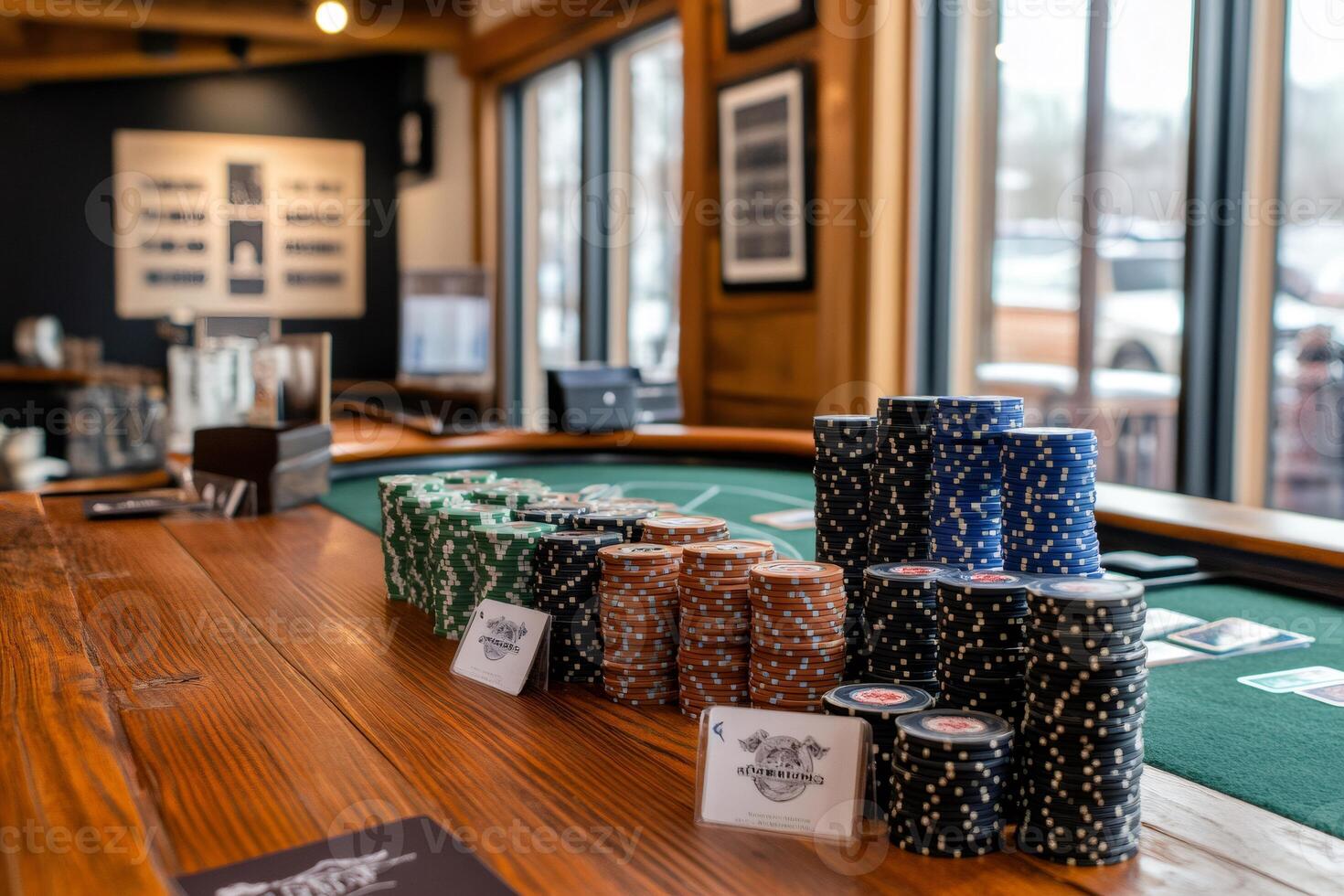 Poker chips stacked on casino table awaiting players photo
