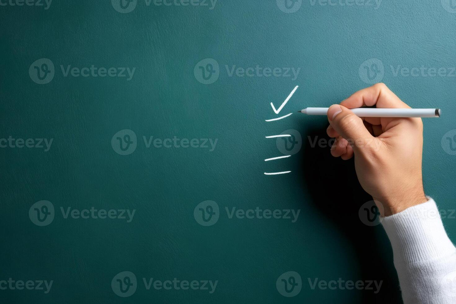 Teacher checking task on chalkboard, completing to do list in classroom photo