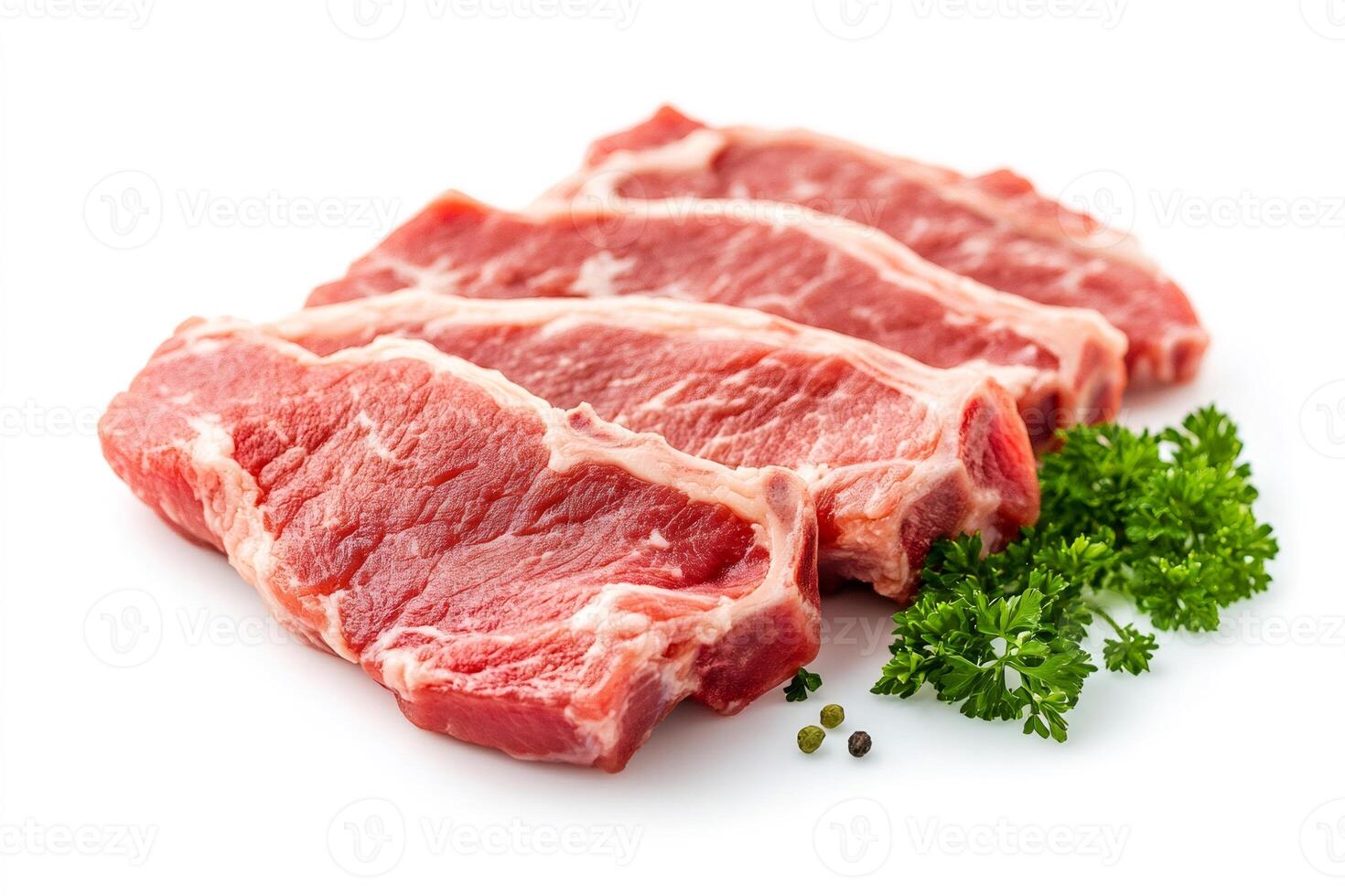 Fresh lamb chops with parsley and peppercorns resting on white background photo