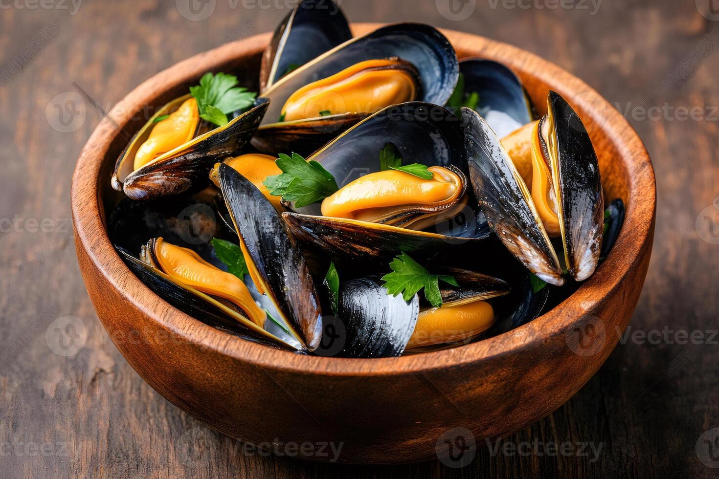 Steamed mussels with parsley in wooden bowl on rustic table photo