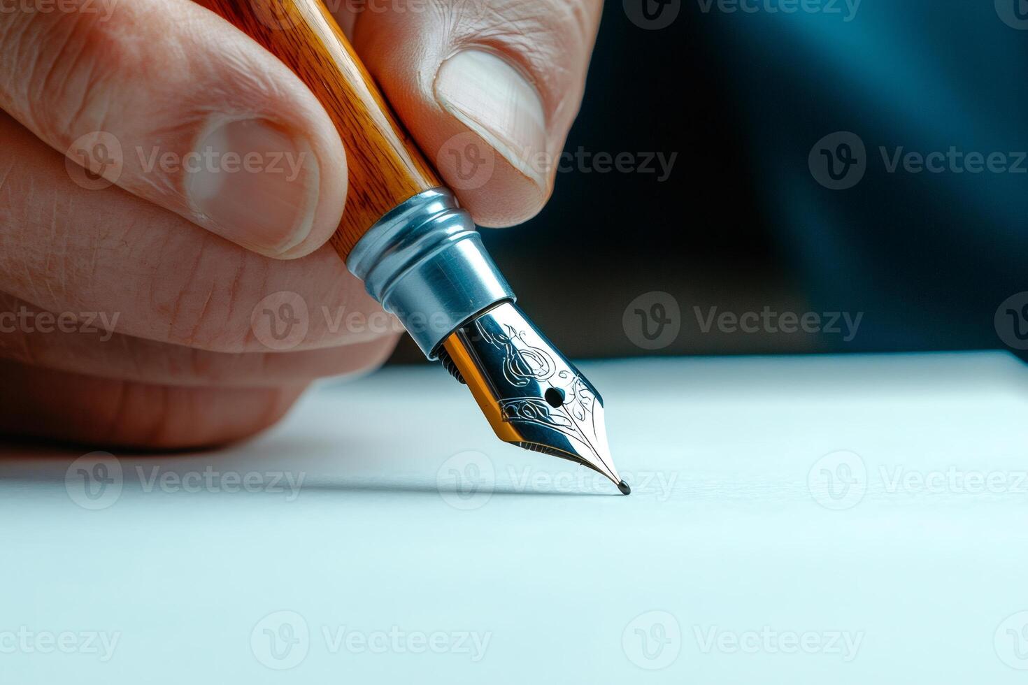 Writer using elegant fountain pen on white paper photo