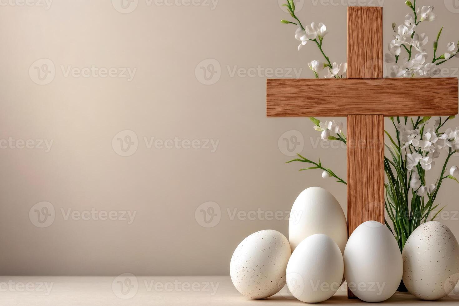 Easter eggs with wooden christian cross and white flowers symbolizing resurrection photo