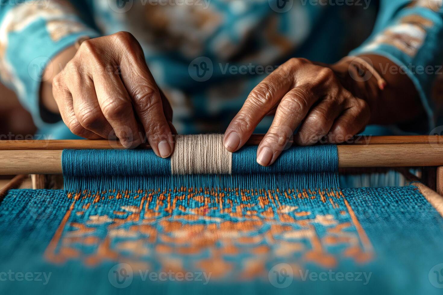 Artisan weaving traditional textile with wooden loom photo