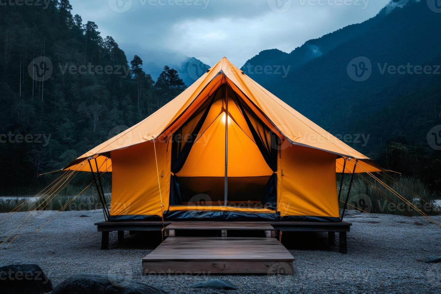 Illuminated tent invites campers to enjoy wilderness at twilight photo