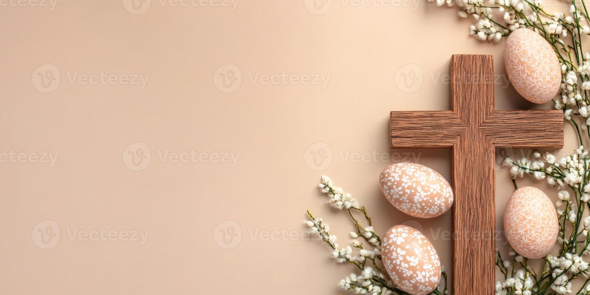 Easter eggs and wooden cross with white flowers on beige background represent christian easter celebration photo