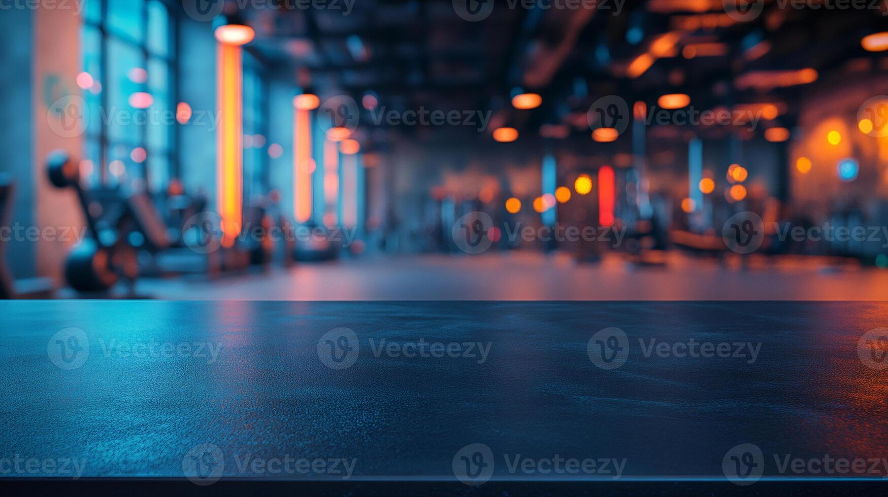 Empty black table over blurred modern gym background photo