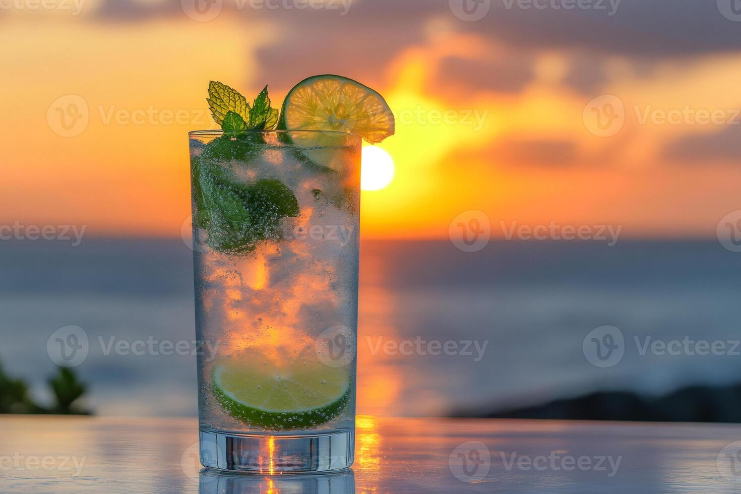 Sparkling mojito enjoying a tropical sunset at the beach bar photo