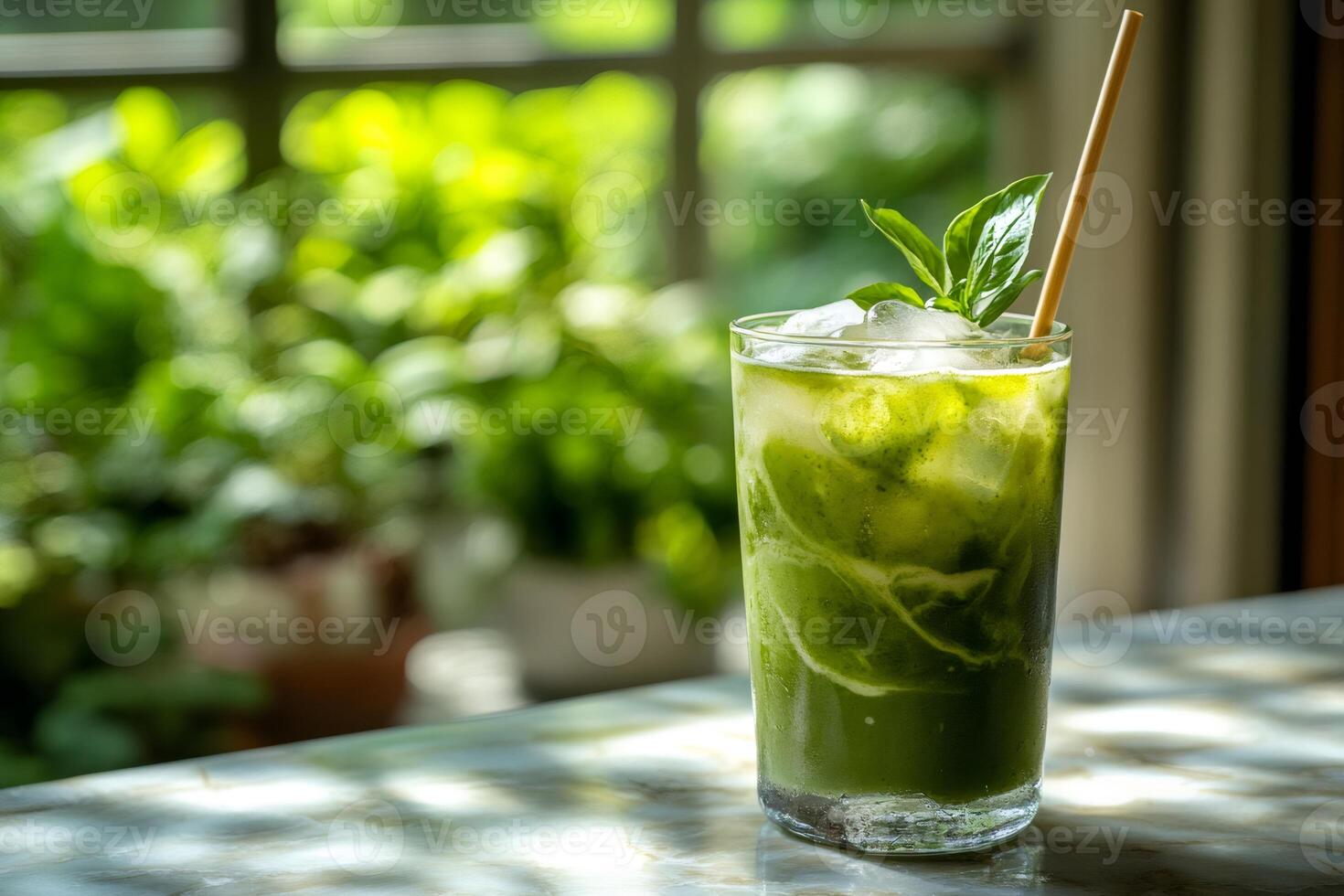 Refreshing green juice with ice cubes and basil leaves on marble surface photo