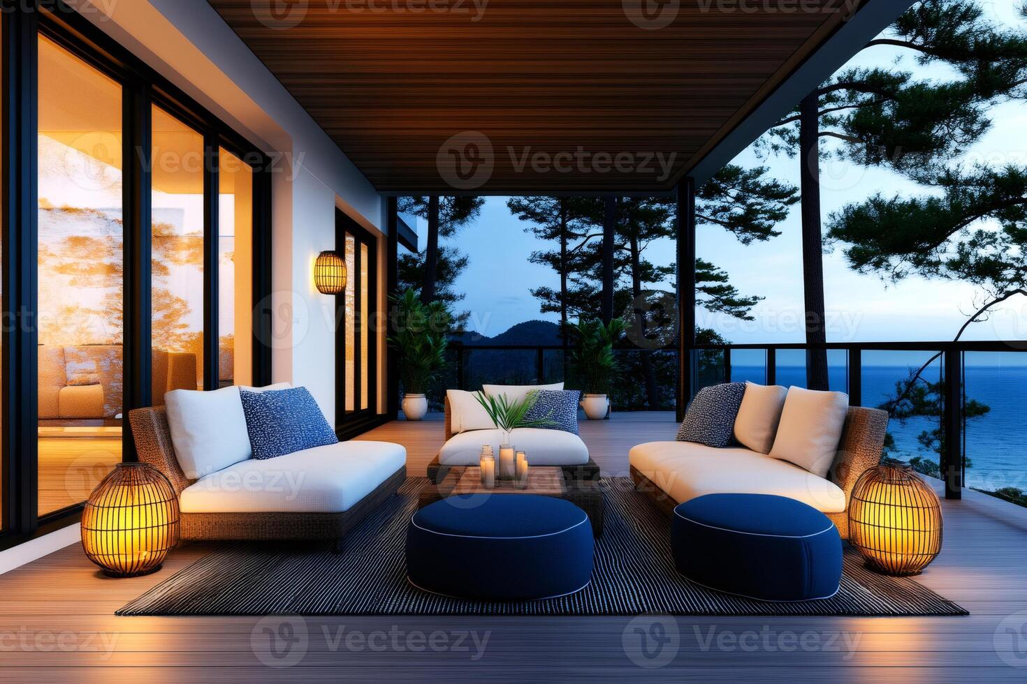 Cozy terrace with sofas, poufs, lamps and sea view at sunset, perfect for relaxing photo
