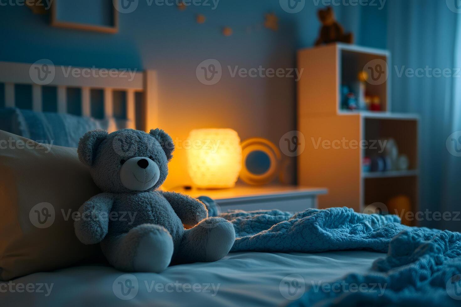 Teddy bear sitting on bed in child's room at night with glowing nightlight photo