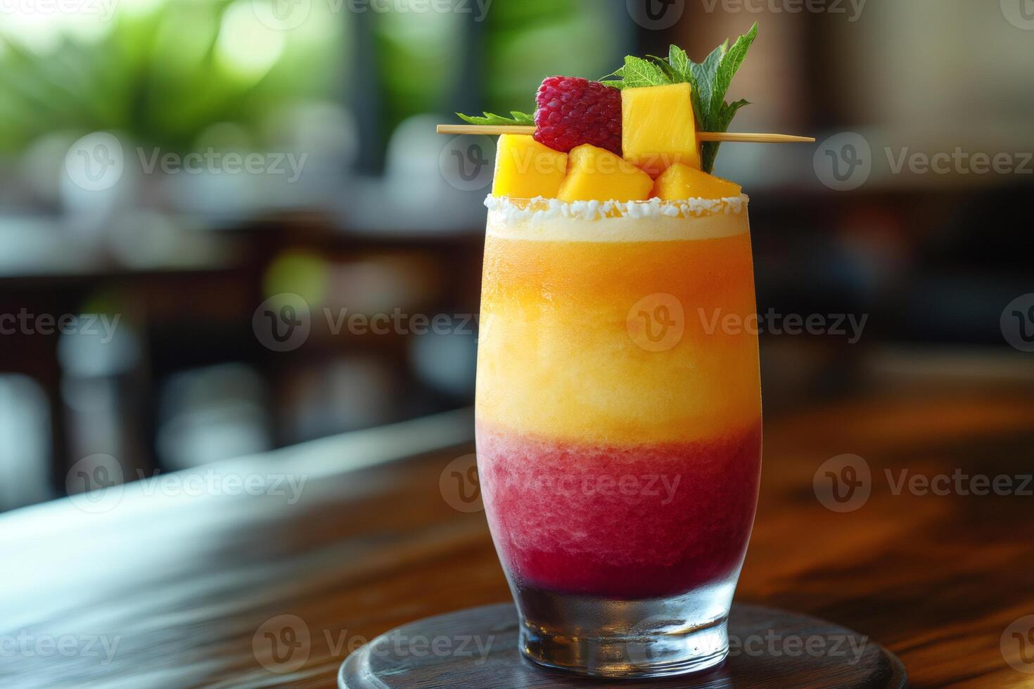 Refreshing layered mango raspberry smoothie decorated with fresh fruit in restaurant setting photo