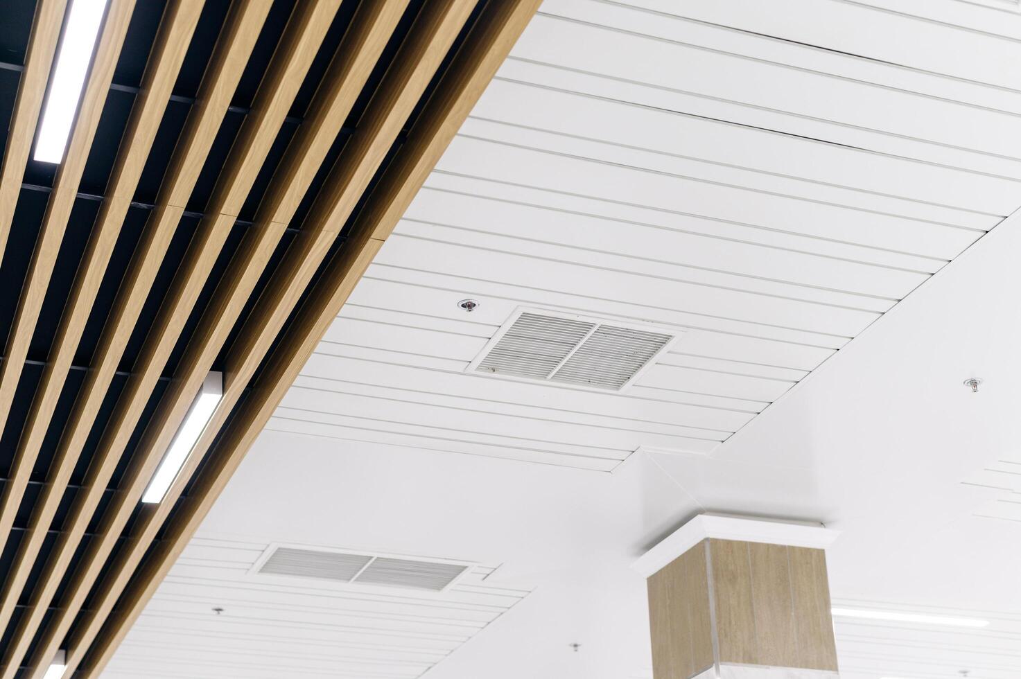 Modern wooden ceiling in a modern office building photo