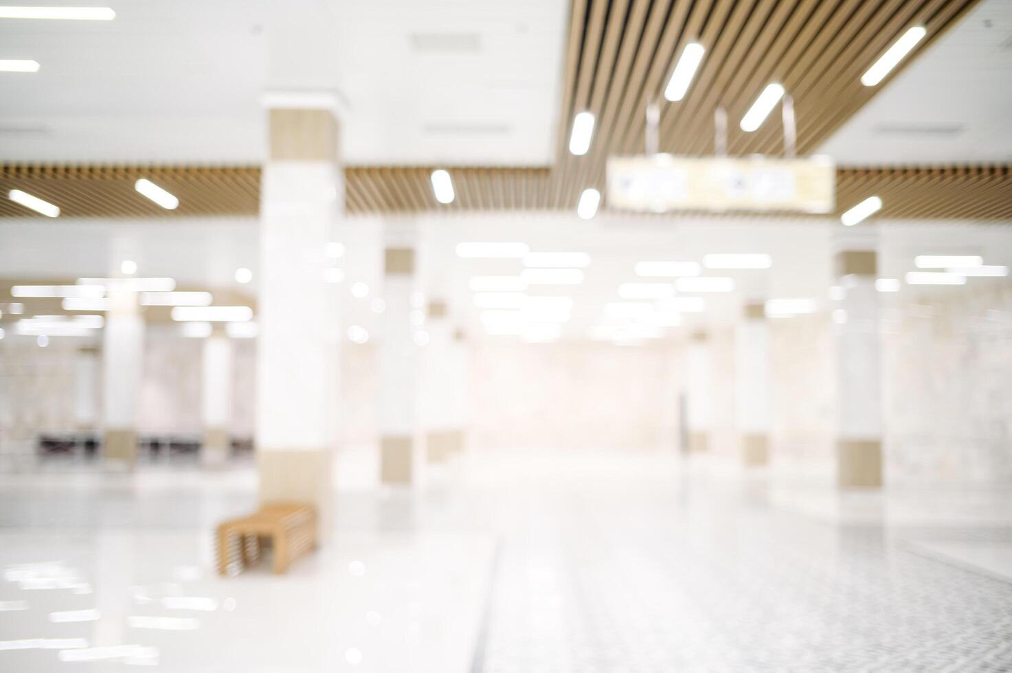 An empty hallway with a lot of light coming from the ceiling photo