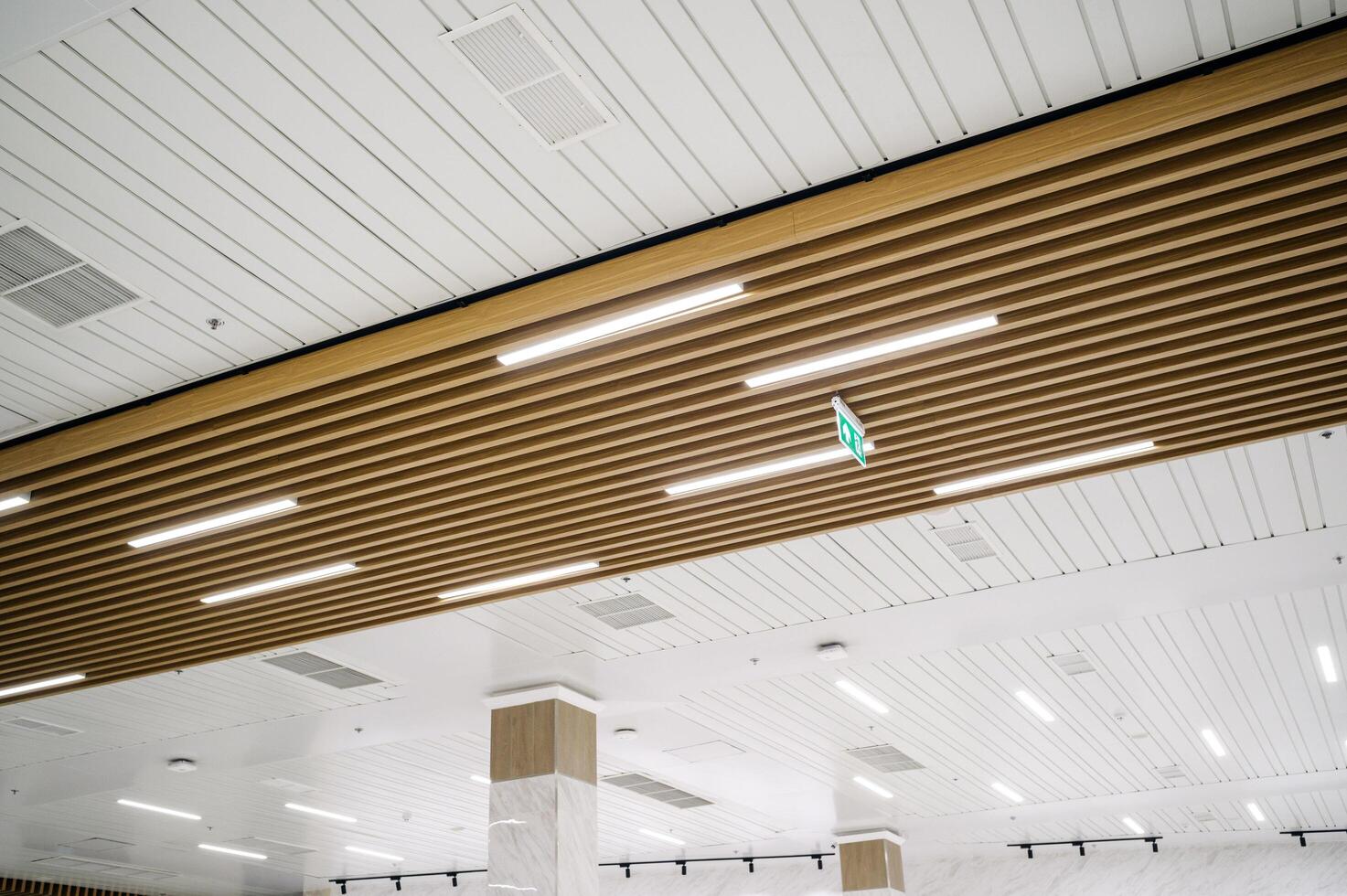 A ceiling with wooden beams and lights photo