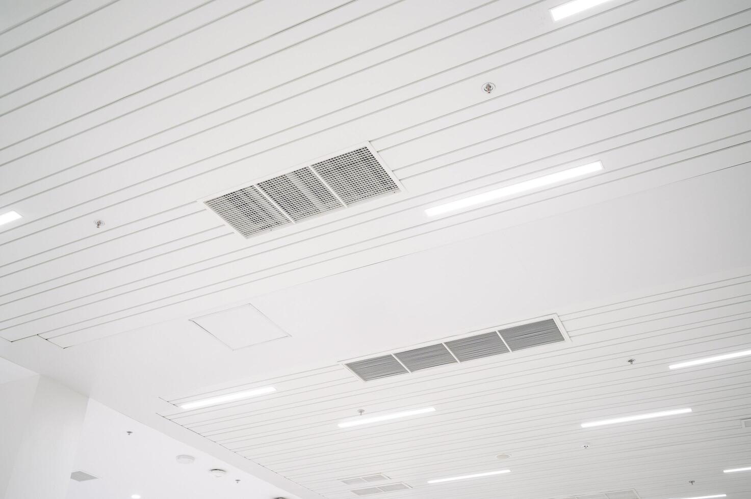 White ceiling with lights and a ceiling fan photo