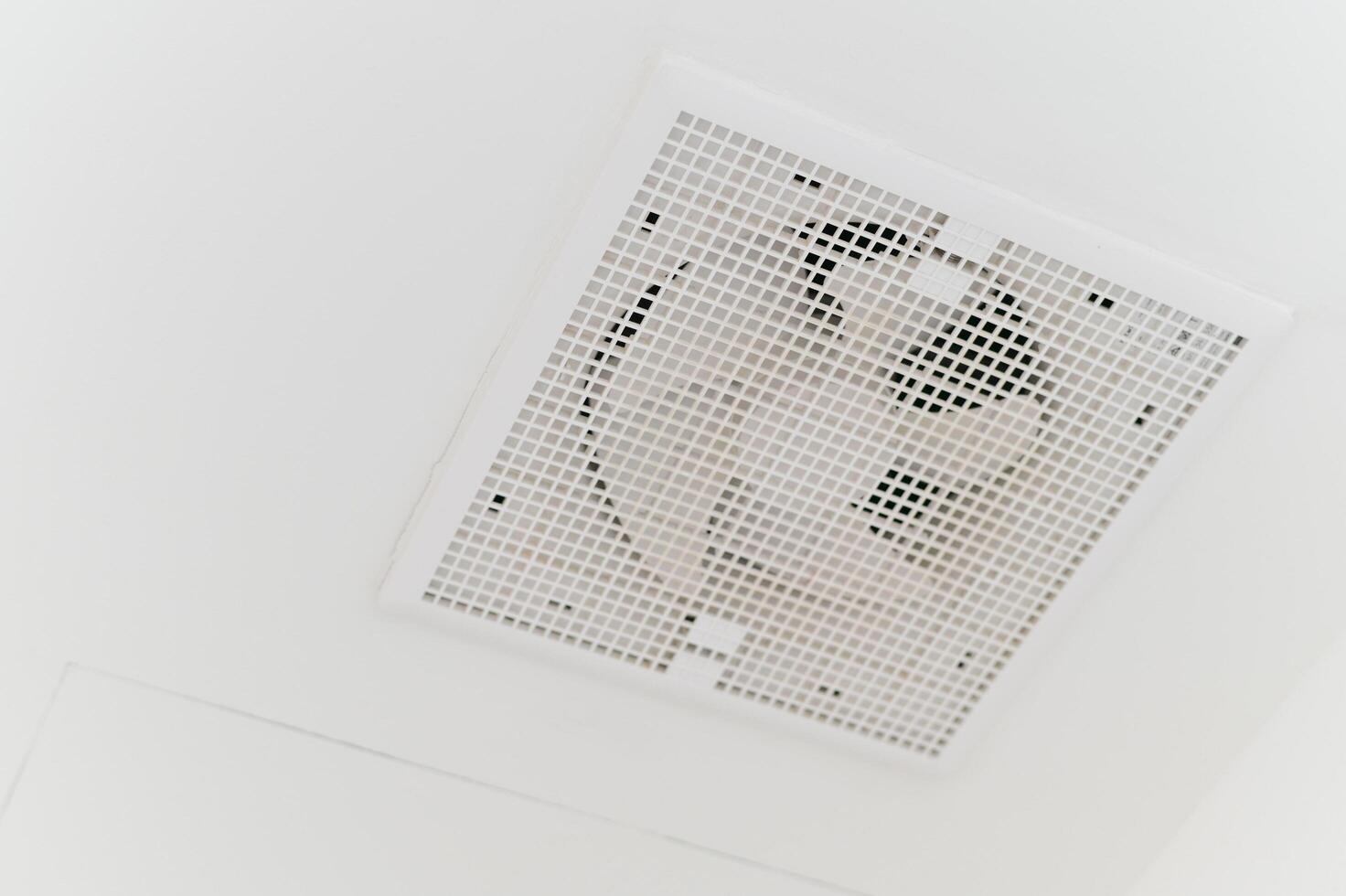 exhaust fan on white ceiling room photo