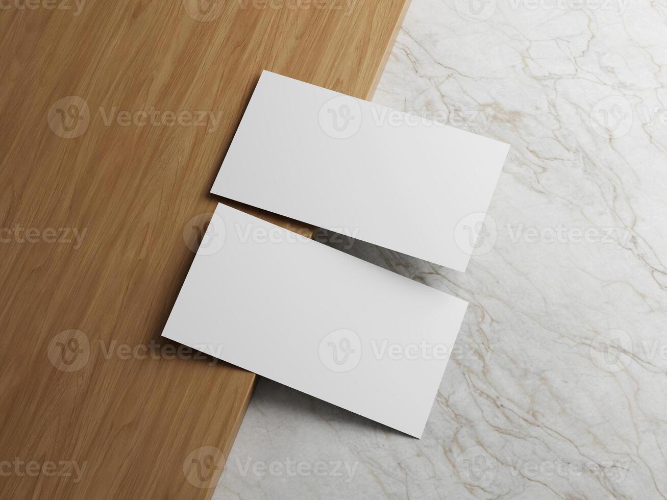 Two white business cards placed on a wooden surface with a marble background, offering a sleek and professional layout. photo