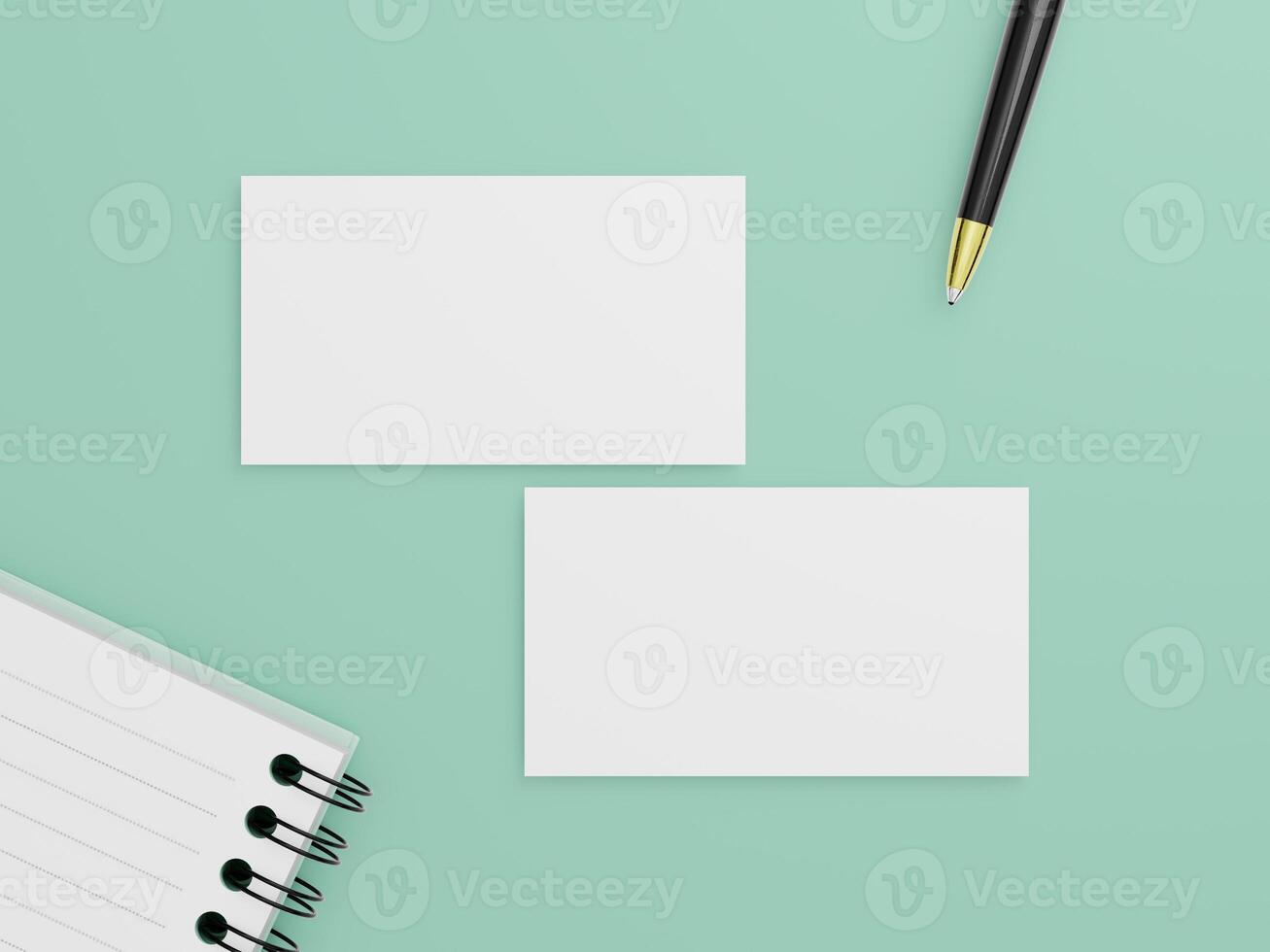 Two business cards placed on a flat background with a black pen and a spiral notebook, ready for showcasing logo or design mockups. photo