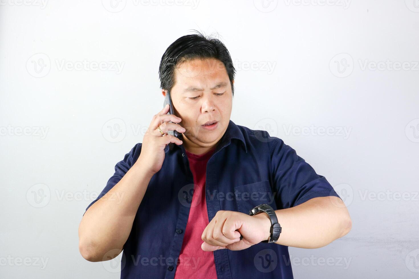 Man checking time during phone call photo