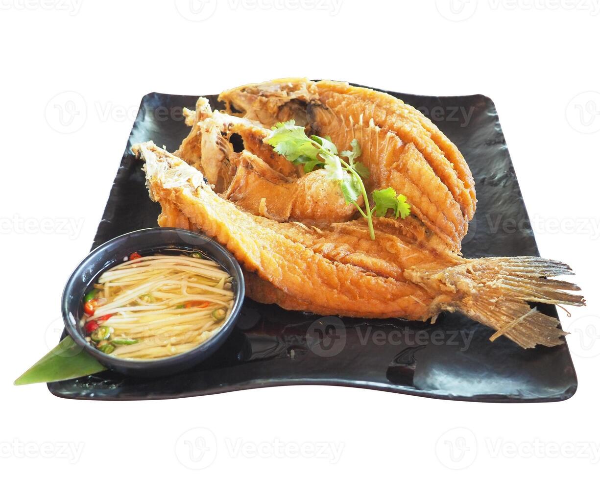 Fried snapper fish isolated on white background. fried fish clipping path isolated object. delicious fish food on black square dish clipart for isolated , clipping path , clipart element photo